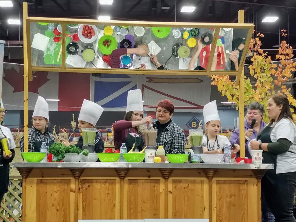 A group of children in a cooking competition